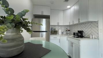 Fridge, microwave, stovetop, coffee/tea maker