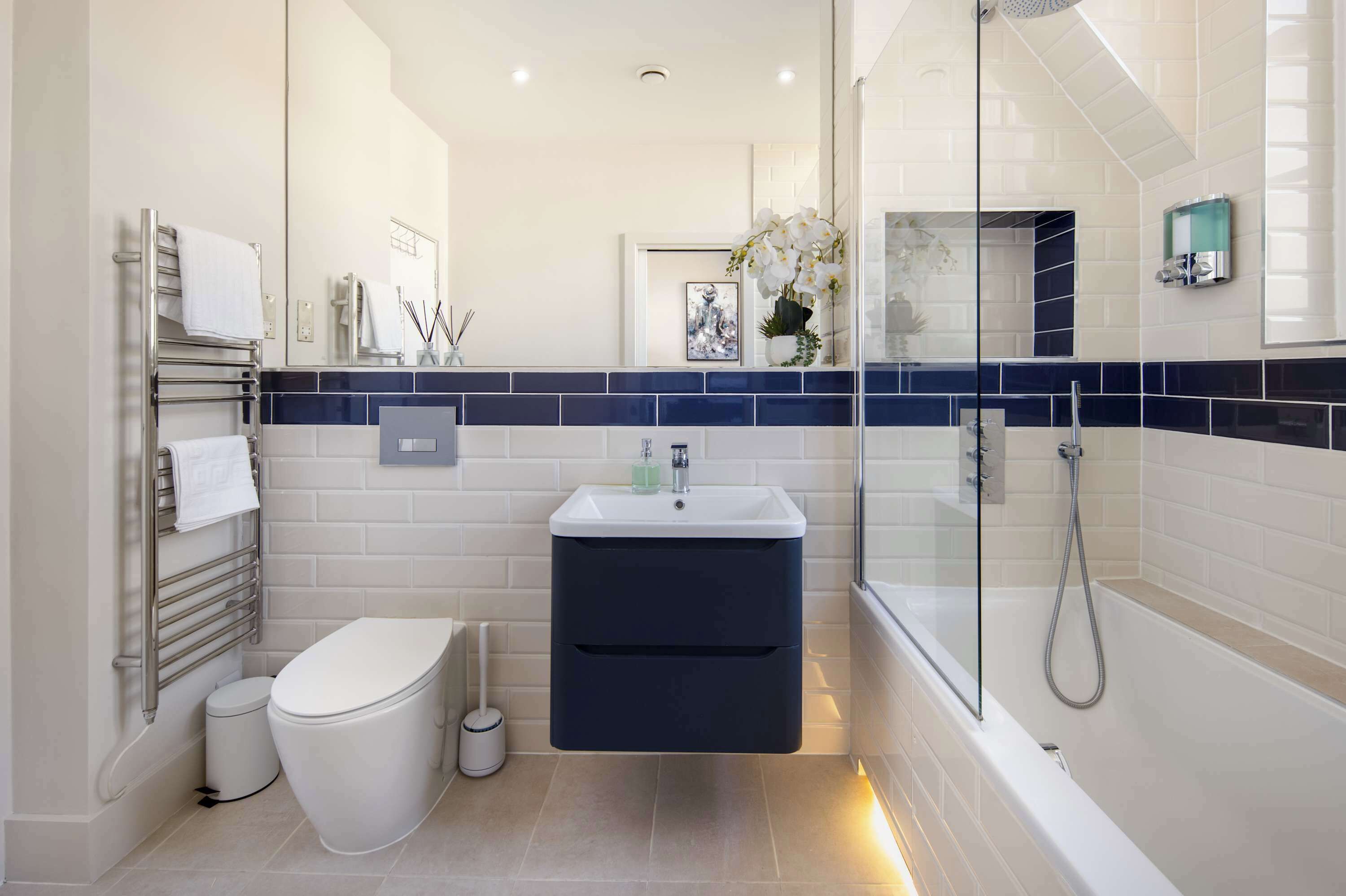 Shower, hair dryer, towels, shampoo