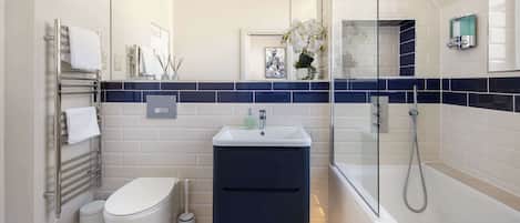 Shower, hair dryer, towels, shampoo