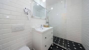 Shower, hair dryer, towels, soap