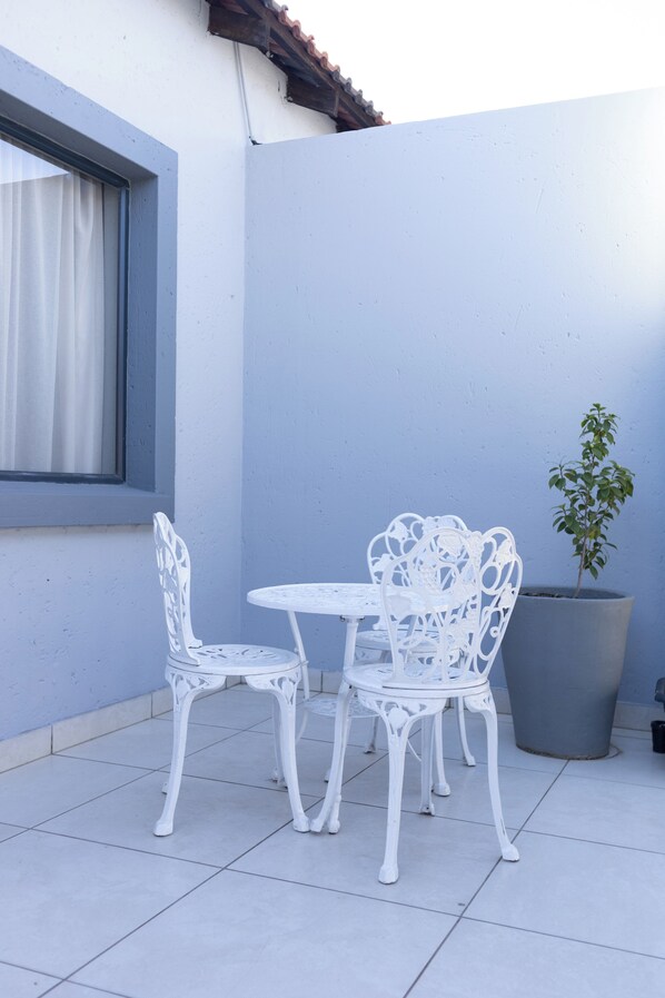 Standard Double Room, Patio, City View | Garden view