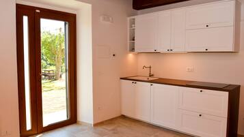 Apartment, Lake View | Private kitchen | Fridge, stovetop, cookware/dishes/utensils