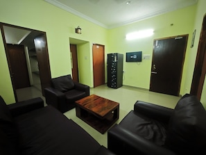 Luxury Apartment, Balcony, City View | Living area | 32-inch plasma TV with satellite channels, printers