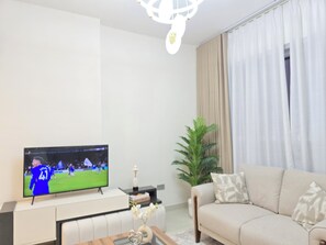 Luxury Apartment, Balcony, City View | Living area | 65-inch Smart TV with digital channels, streaming services - LUXURY BOULEVARD 2BHK (Abu Dhabi)