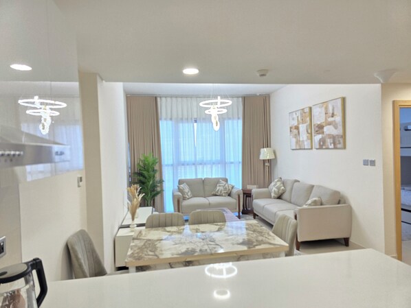 Luxury Apartment, Balcony, City View | Living area | 65-inch Smart TV with digital channels, streaming services - LUXURY BOULEVARD 2BHK (Abu Dhabi)