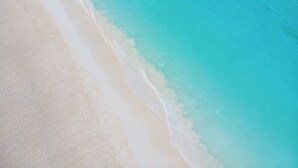 An aerial view of a beach with clear turquoise water and white sand. - Hiliki Holiday Home Paje - by Liv Zanzibar (Paje)