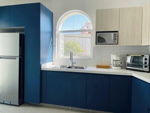 Fridge, microwave, stovetop, coffee/tea maker