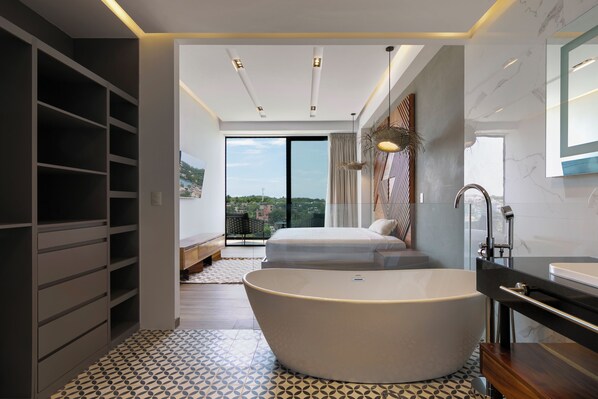 Separate bathtub and shower, hair dryer, towels, soap