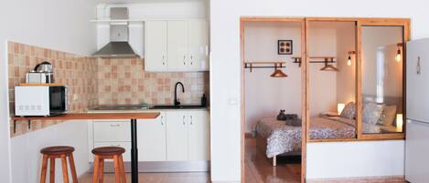 Fridge, microwave, stovetop, coffee/tea maker