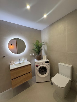 Hair dryer, towels, soap, shampoo