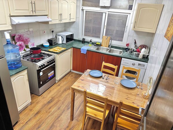 Standard Shared Dormitory, Balcony, City View | Shared kitchen | Full-size fridge, microwave, oven, stovetop