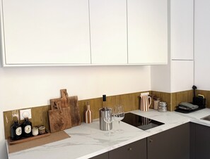 Fridge, microwave, stovetop, coffee/tea maker