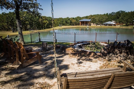 Property grounds. Charming 2-bedroom house on 40 acres in Springtown with pond