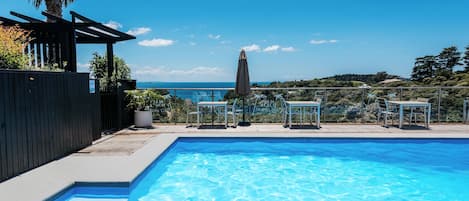 Outdoor pool, pool umbrellas, sun loungers