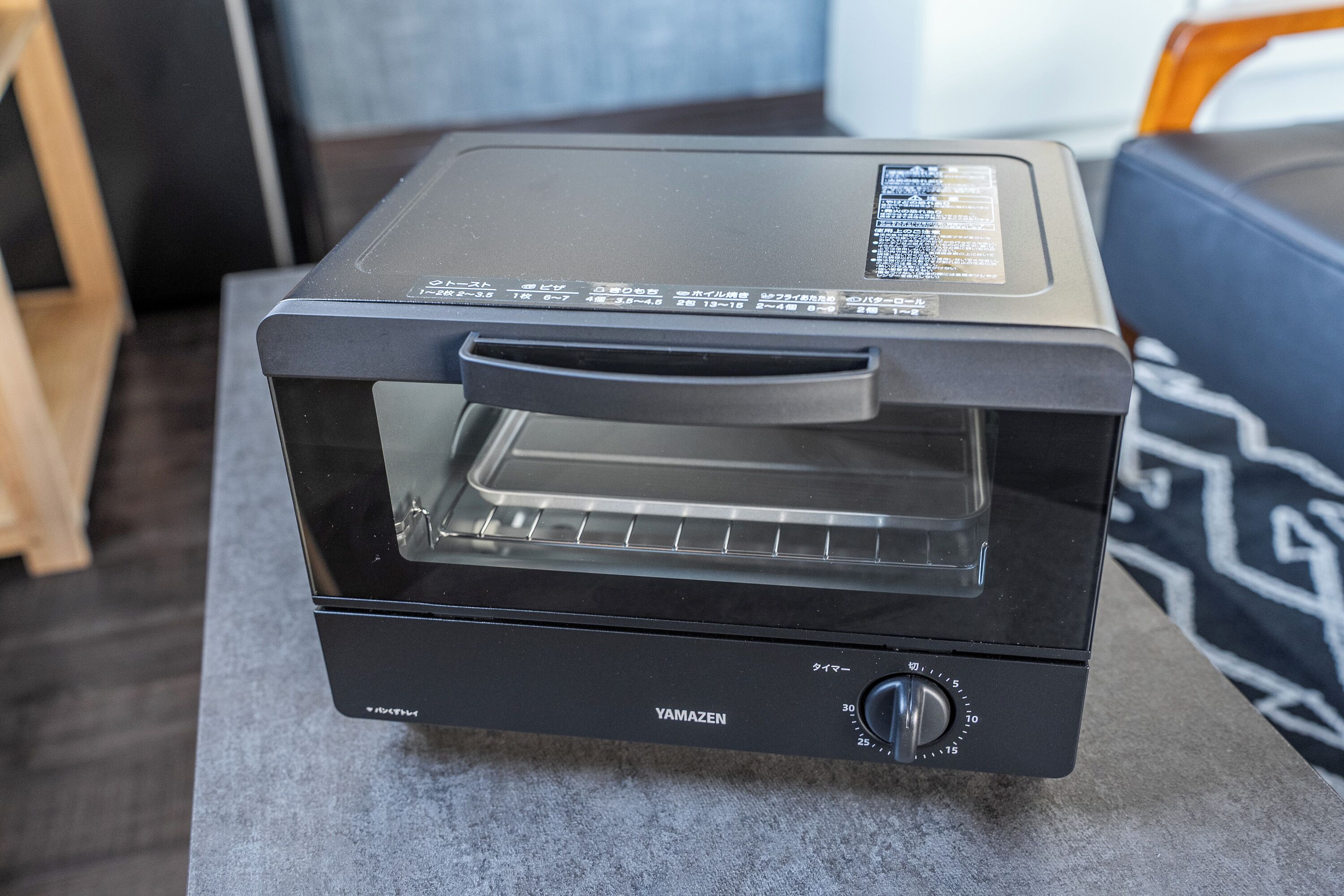 A black YAMAZEN toaster oven with a digital display and a control knob.