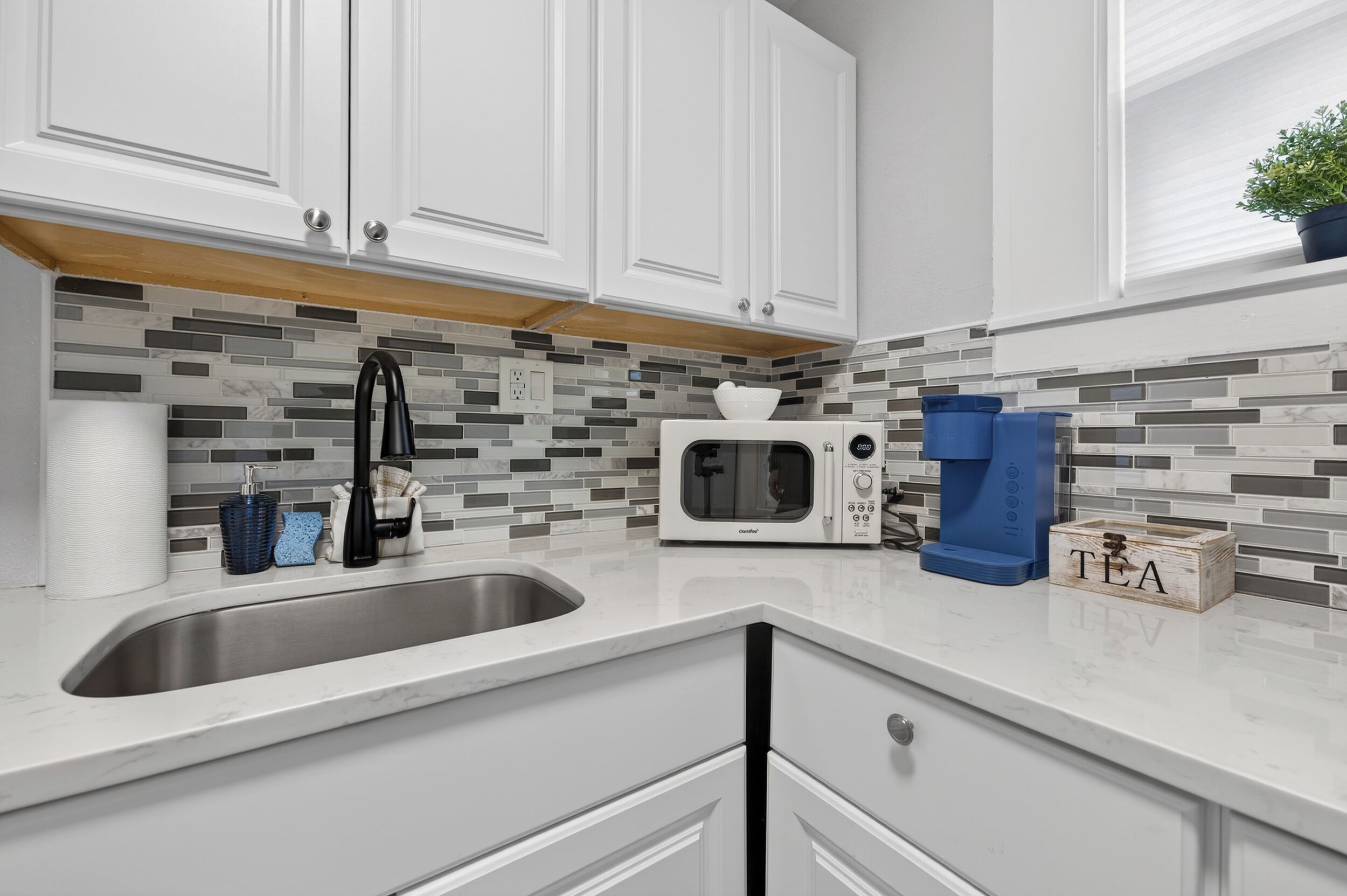 Fridge, microwave, stovetop, coffee/tea maker