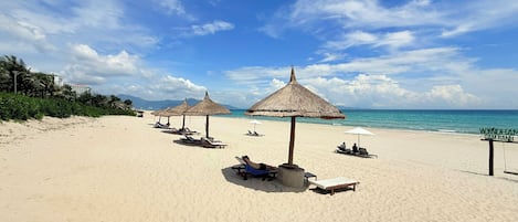 On the beach, white sand, free beach shuttle, sun loungers