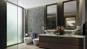 A modern bathroom with a large mirror, two sinks, a bidet, and a glass shower enclosure. - Bang Giang EcoGreen Hotel (Thuc Phan)