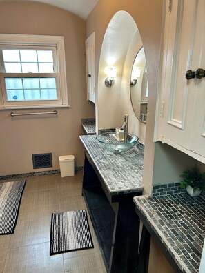 Shower, jetted bath, towels, soap