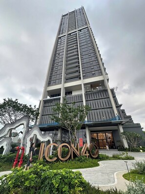 A tall, modern building with a prominent entrance and a large sign reading "ICON40". - Halong Seaside Retreat (Bai Chay)