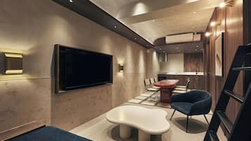 Superior Studio Suite | Living area | TV