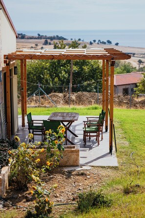 Deluxe House, Kitchen, Sea View | Terrace/patio