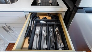 A kitchen drawer with utensils neatly organized. - The McKinley (Lewiston)