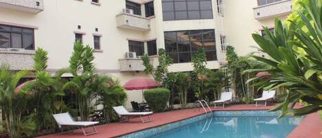 Outdoor pool, open 7:00 AM to 7:00 PM, pool umbrellas, sun loungers