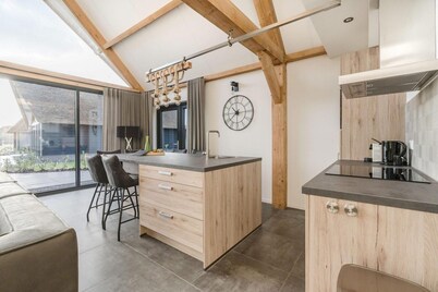 Modern bungalow in Baarle-Nassau with pond view