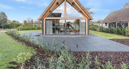 Modern bungalow in Baarle-Nassau with pond view