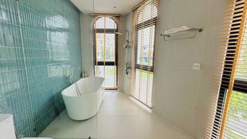 Shower, hair dryer, towels, soap