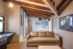 Family Apartment, City View | Living area | Smart TV