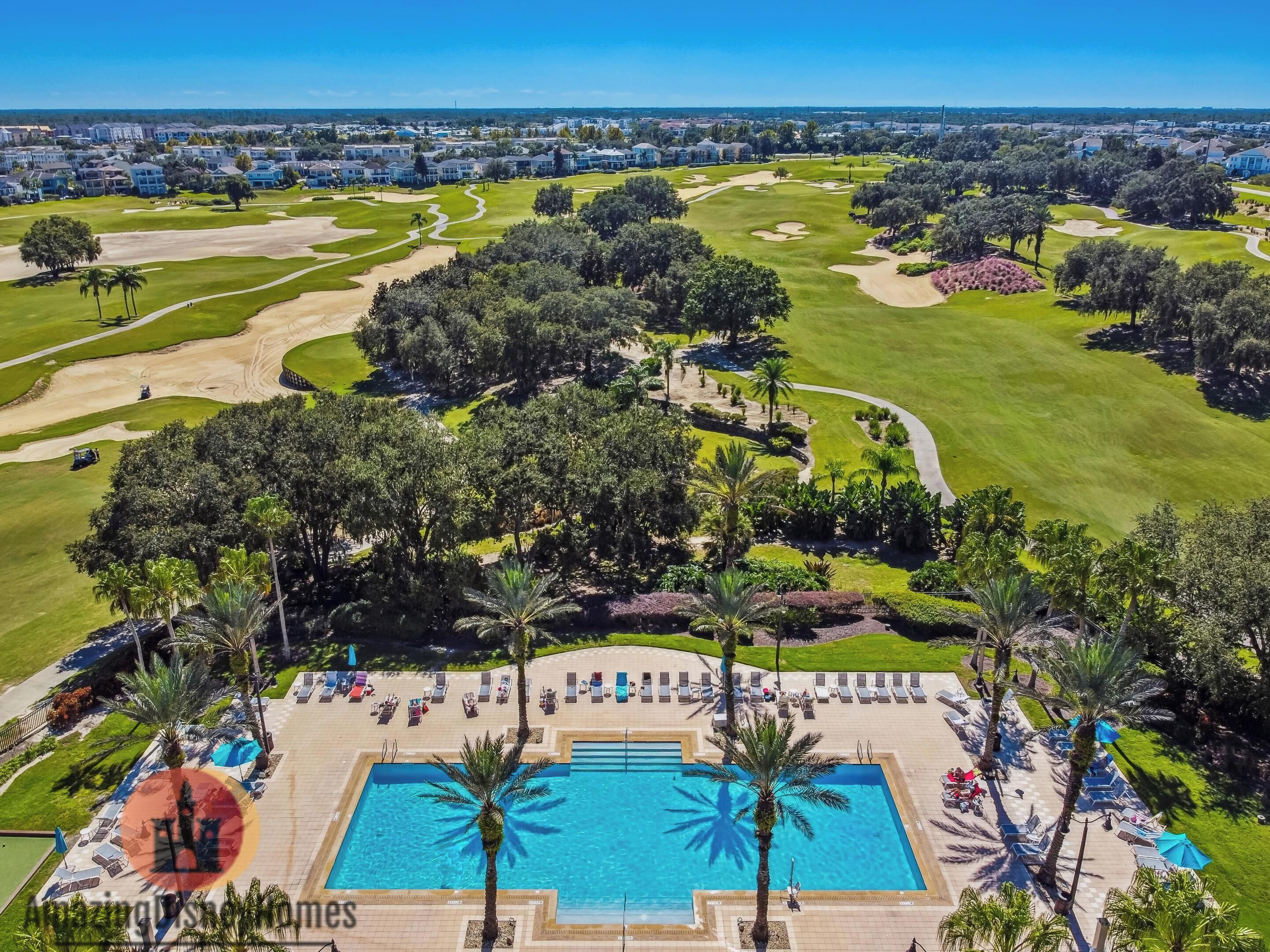 A golf course with a swimming pool and lounge area.