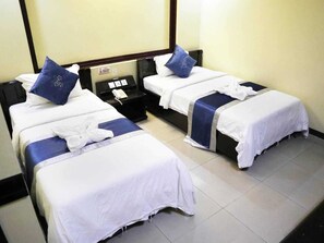 Habitación Deluxe con 1 cama doble o 2 individuales, vistas a la ciudad | Escritorio y wifi gratis