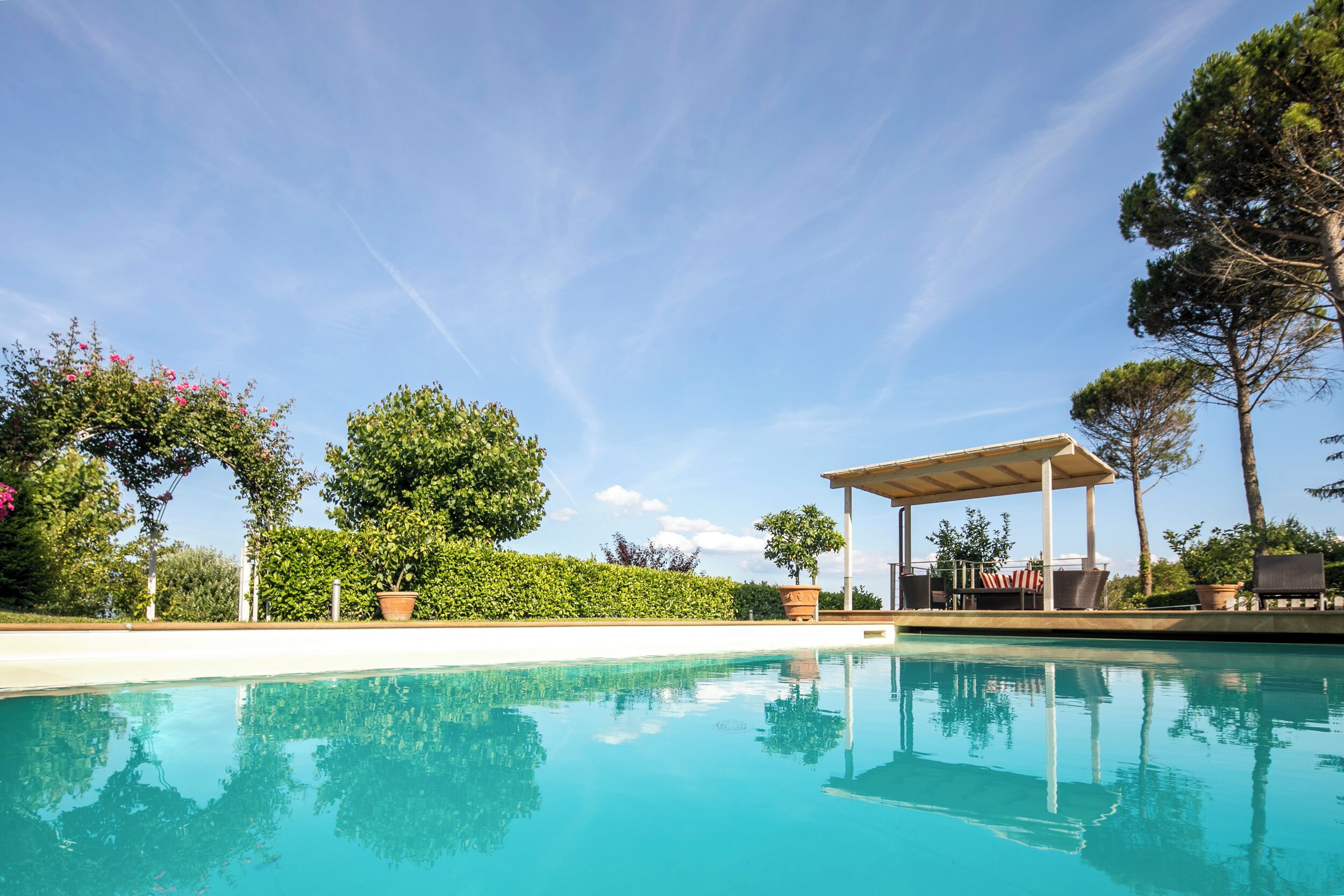 Seasonal outdoor pool, pool umbrellas, pool loungers