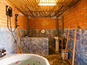 Deluxe Room, 1 King Bed, Balcony | Bathroom | Separate tub and shower, hydromassage showerhead, free toiletries