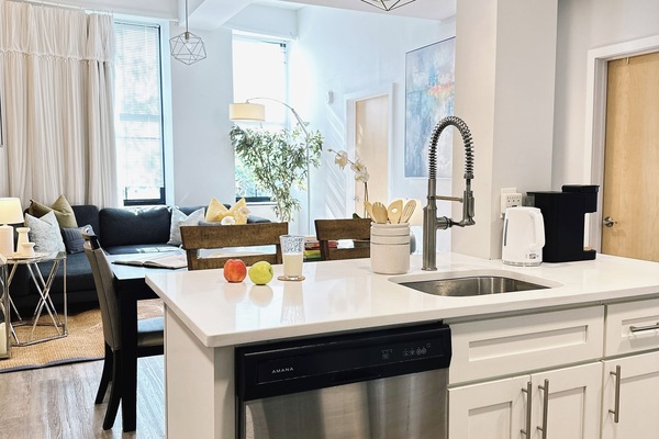 Bright, open kitchen blending seamlessly with the living space.