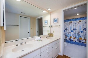 Shower, hair dryer, towels, shampoo