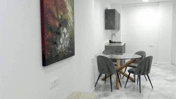 Deluxe Apartment, Balcony, City View | Living area | 40-inch LED TV with digital channels