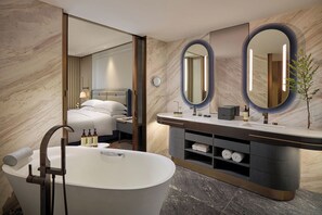 Separate tub and shower, rainfall showerhead, designer toiletries