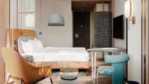 A modern hotel room with a bed, a sofa, a small table, and a TV. - Mövenpick Yerevan (Yerevan)