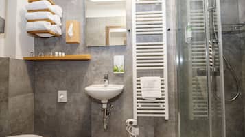 Shower, towels, soap, toilet paper