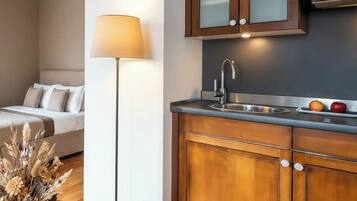 A modern kitchen with wooden cabinets, a stainless steel sink, and a countertop.