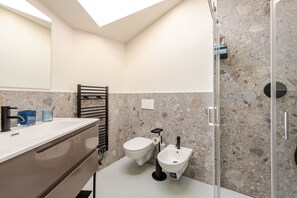 Suite, City View | Bathroom | Shower, hair dryer, towels, soap