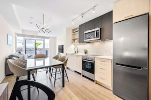 Townhome, Non Smoking, City View | Private kitchen | Fridge, microwave, oven, dishwasher - Contemporary Stays in the Heart of the Stockyards (Toronto)