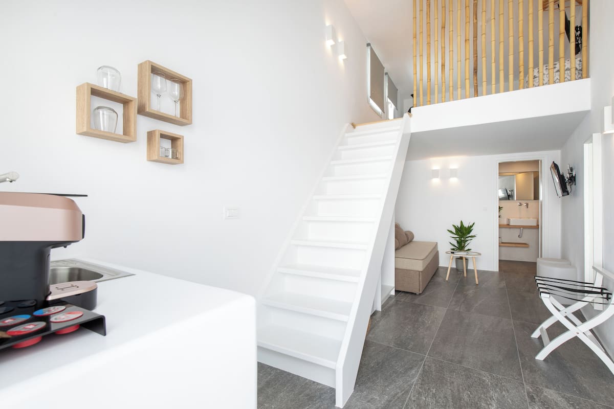 Superior Suite, Patio, Courtyard View | Premium bedding, Select Comfort beds, in-room safe, iron/ironing board