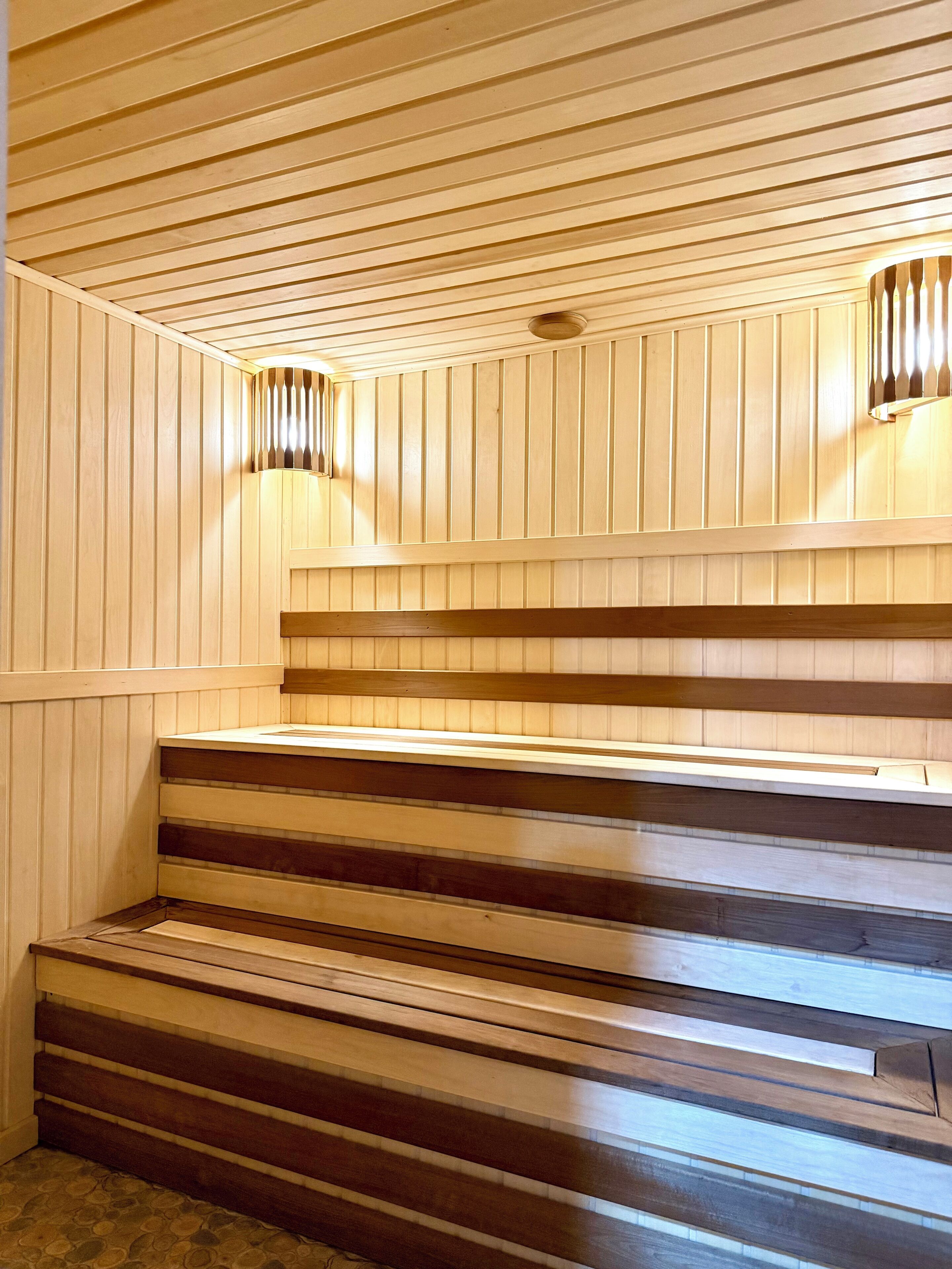 A wooden staircase with a sloped design, leading to a higher level.