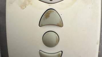 A white square-shaped object with the brand name "Profalux" and three circular indentations.
