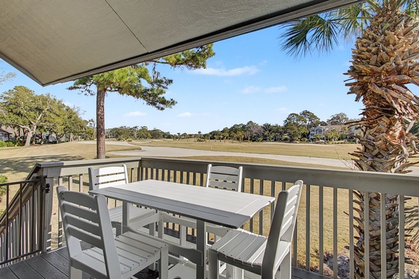 Dine al fresco on your private covered balcony overlooking the expansive golf course fairways and tropical palm trees.