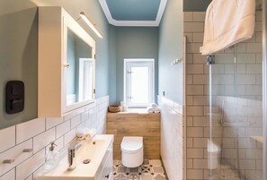 Shower, hair dryer, towels, toilet paper